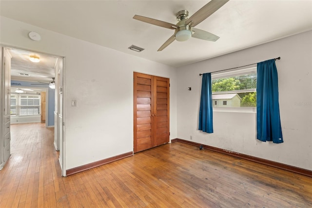 2538 Meadowview Ln, Deland, FL 32720 - unfurnished bedroom with light wood-type flooring, a closet, and ceiling fan