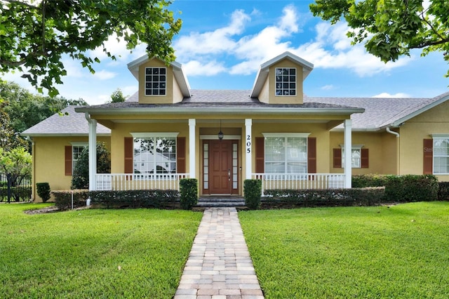 205 Trail Bridge Ct, Winter Garden, FL 34787 - view of front of home featuring a porch, stucco siding, and a front yard