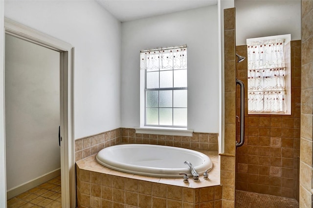 205 Trail Bridge Ct, Winter Garden, FL 34787 - bathroom featuring a tile shower, a bath, and tile patterned flooring