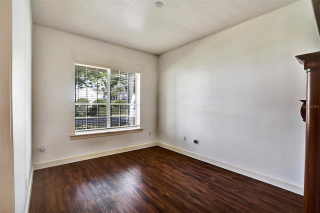 205 Trail Bridge Ct, Winter Garden, FL 34787 - unfurnished room featuring dark wood-type flooring and a textured ceiling