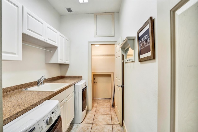205 Trail Bridge Ct, Winter Garden, FL 34787 - laundry room with washer and clothes dryer, cabinet space, and light tile patterned floors