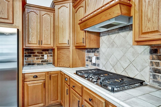 205 Trail Bridge Ct, Winter Garden, FL 34787 - kitchen with stainless steel appliances, custom exhaust hood, tile countertops, and backsplash