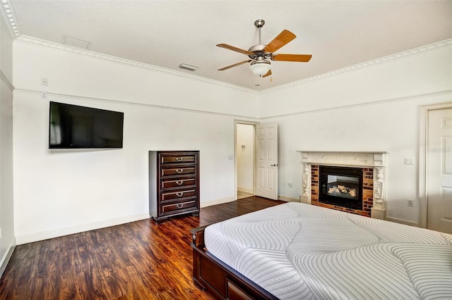 205 Trail Bridge Ct, Winter Garden, FL 34787 - bedroom with wood finished floors, crown molding, a brick fireplace, and ceiling fan