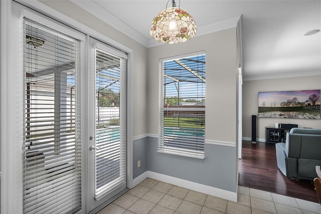 3711 Half Moon Dr, Orlando, FL 32812 - doorway to outside featuring crown molding and light tile patterned flooring