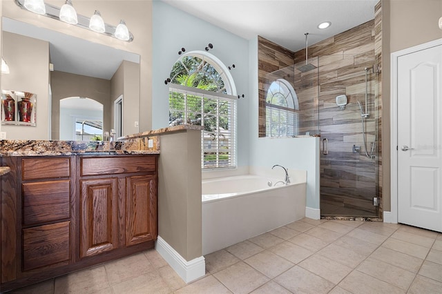 3711 Half Moon Dr, Orlando, FL 32812 - full bath featuring a garden tub, vanity, a shower stall, tile patterned floors, and recessed lighting