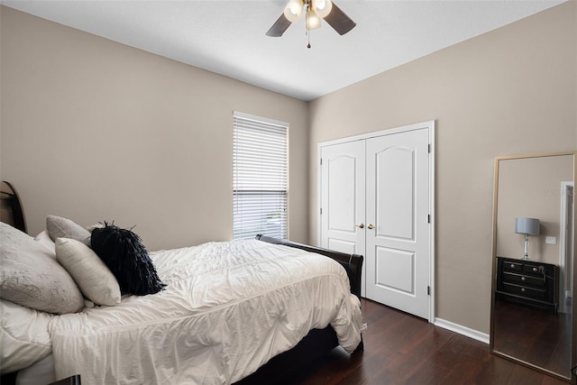 3711 Half Moon Dr, Orlando, FL 32812 - bedroom featuring dark wood-style floors, a closet, and a ceiling fan