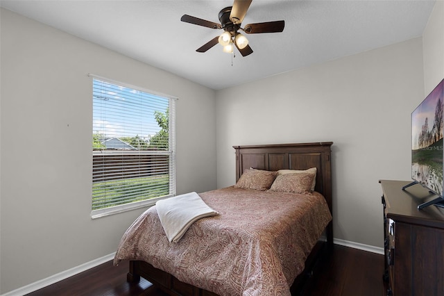 3711 Half Moon Dr, Orlando, FL 32812 - bedroom with dark wood finished floors and ceiling fan