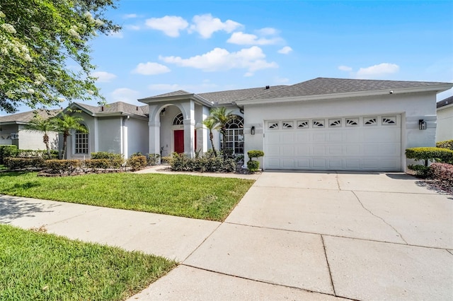 3711 Half Moon Dr, Orlando, FL 32812 - ranch-style house featuring stucco siding, a garage, driveway, and a front lawn