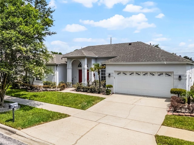 3711 Half Moon Dr, Orlando, FL 32812 - single story home with a shingled roof, stucco siding, a garage, concrete driveway, and a front yard