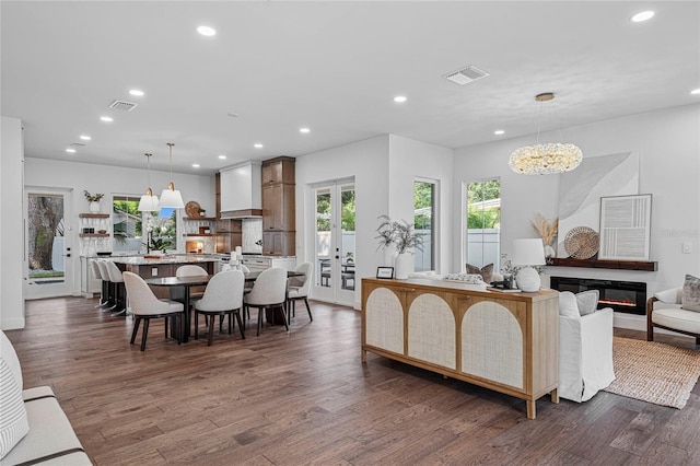 1780 Mizell Ave, Winter Park, FL 32789 - living area with recessed lighting, dark wood-type flooring, a chandelier, and a glass covered fireplace