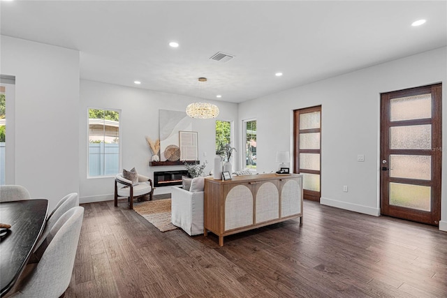 1780 Mizell Ave, Winter Park, FL 32789 - living area featuring dark wood-style floors, recessed lighting, a chandelier, and a glass covered fireplace