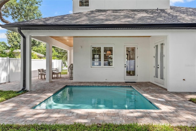 1780 Mizell Ave, Winter Park, FL 32789 - rear view of property featuring a patio, an outdoor pool, a shingled roof, and stucco siding