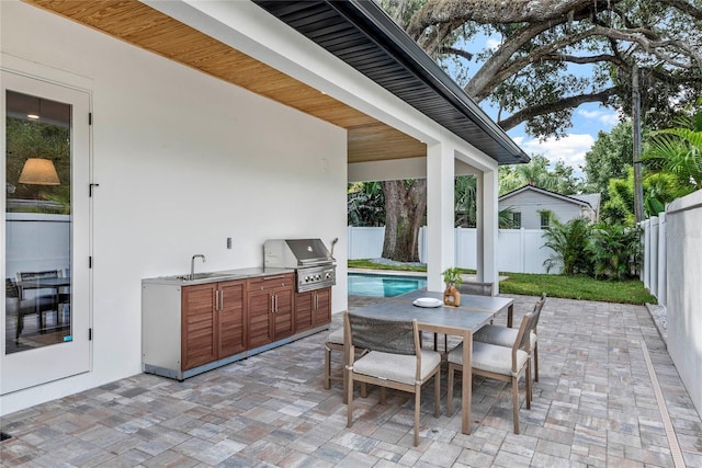 1780 Mizell Ave, Winter Park, FL 32789 - fenced backyard with an outdoor kitchen, a patio area, and outdoor dining area