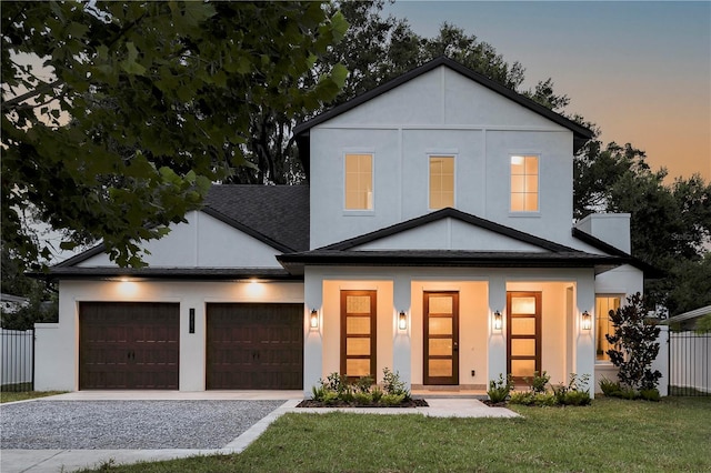 1780 Mizell Ave, Winter Park, FL 32789 - view of front facade featuring driveway, an attached garage, stucco siding, and roof with shingles