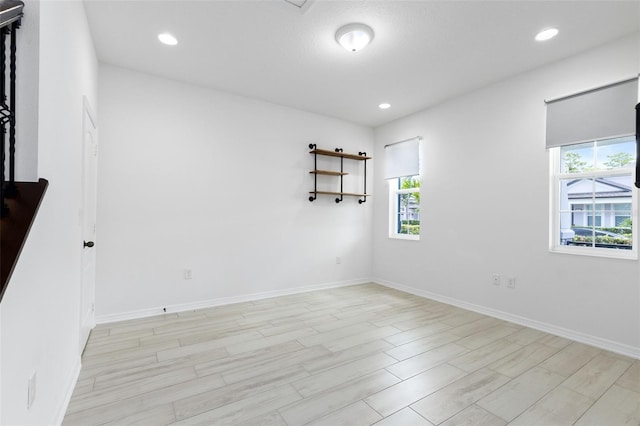 12216 Encore At Ovation Way, Winter Garden, FL 34787 - spare room with plenty of natural light, light wood-style floors, and recessed lighting