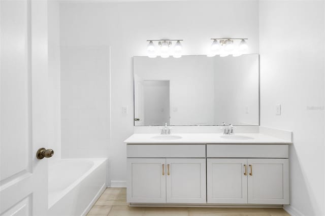 12216 Encore At Ovation Way, Winter Garden, FL 34787 - bathroom with double vanity and baseboards