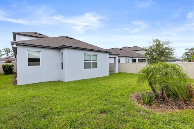 12216 Encore At Ovation Way, Winter Garden, FL 34787 - back of property featuring a shingled roof and stucco siding