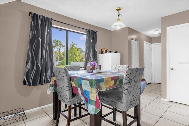 2728 Tally Ho Ave 2722, 2724, 2726, Orlando, FL 32826 - dining room featuring light tile patterned floors and a textured ceiling