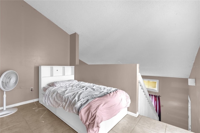 2728 Tally Ho Ave 2722, 2724, 2726, Orlando, FL 32826 - bedroom with vaulted ceiling, tile patterned flooring, and a textured ceiling
