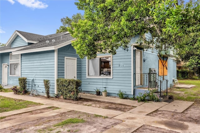 2728 Tally Ho Ave 2722, 2724, 2726, Orlando, FL 32826 - view of front of home with a shingled roof