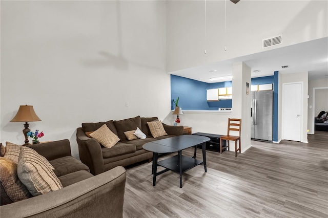 2728 Tally Ho Ave 2722, 2724, 2726, Orlando, FL 32826 - living room with wood finished floors and a high ceiling