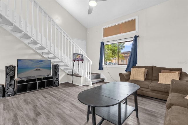 2728 Tally Ho Ave 2722, 2724, 2726, Orlando, FL 32826 - living room featuring wood finished floors, stairway, ceiling fan, and a towering ceiling
