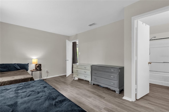 2728 Tally Ho Ave 2722, 2724, 2726, Orlando, FL 32826 - bedroom featuring wood finished floors and baseboards