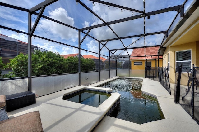 148 Miro Dr, Davenport, FL 33837 - view of swimming pool featuring a pool with connected hot tub, a patio area, and a lanai