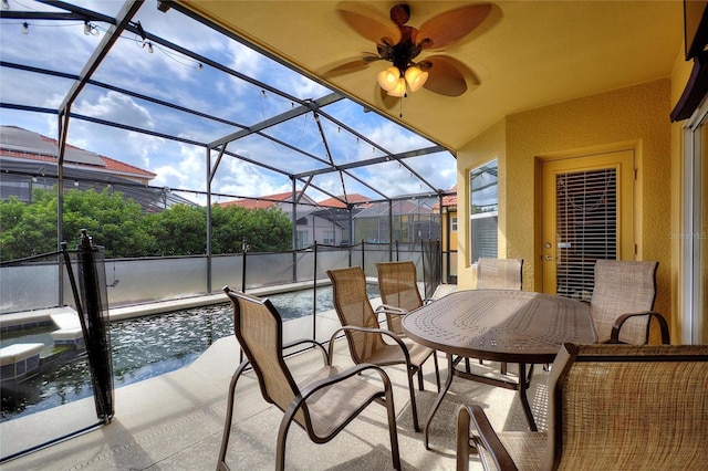 148 Miro Dr, Davenport, FL 33837 - view of patio featuring glass enclosure, outdoor dining space, ceiling fan, and an outdoor pool