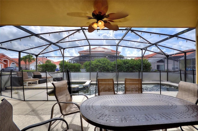 148 Miro Dr, Davenport, FL 33837 - view of patio featuring outdoor dining area, a ceiling fan, glass enclosure, and a pool with connected hot tub