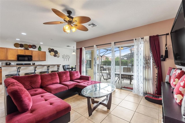 148 Miro Dr, Davenport, FL 33837 - living room featuring ceiling fan, light tile patterned floors, and recessed lighting