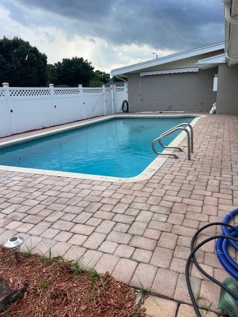 229 Doverwood Rd, Fern Park, FL 32730 - view of swimming pool featuring a patio area and a gate