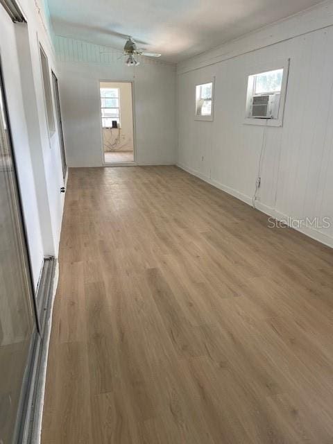 229 Doverwood Rd, Fern Park, FL 32730 - empty room featuring light wood-style flooring, cooling unit, and a ceiling fan