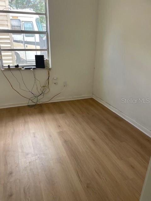 229 Doverwood Rd, Fern Park, FL 32730 - spare room featuring wood finished floors and baseboards