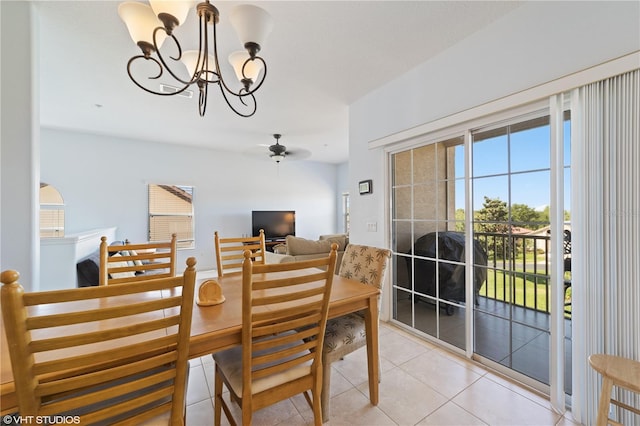 20130 Sunset Landing Ave, Groveland, FL 34736 - dining area featuring a chandelier, light tile patterned flooring, and a ceiling fan