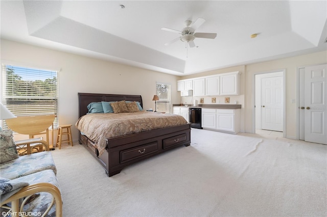 20130 Sunset Landing Ave, Groveland, FL 34736 - bedroom featuring a tray ceiling, light carpet, a ceiling fan, and wine cooler