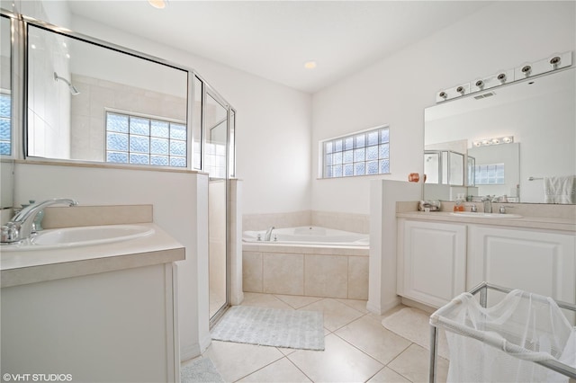 20130 Sunset Landing Ave, Groveland, FL 34736 - bathroom featuring plenty of natural light, a garden tub, and a shower stall