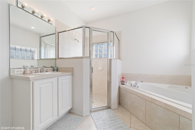 20130 Sunset Landing Ave, Groveland, FL 34736 - full bathroom featuring a bath, a stall shower, plenty of natural light, and vanity