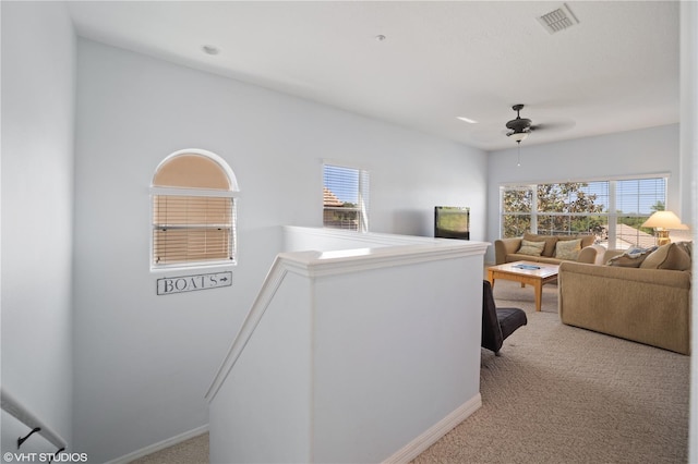 20130 Sunset Landing Ave, Groveland, FL 34736 - living area featuring light colored carpet, healthy amount of natural light, and a ceiling fan