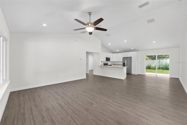 654 NE 130th Ct, Silver Springs, FL 34488 - unfurnished living room with dark wood-style floors, recessed lighting, ceiling fan, and vaulted ceiling
