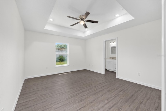 654 NE 130th Ct, Silver Springs, FL 34488 - unfurnished room with a raised ceiling, ceiling fan, dark wood finished floors, and recessed lighting