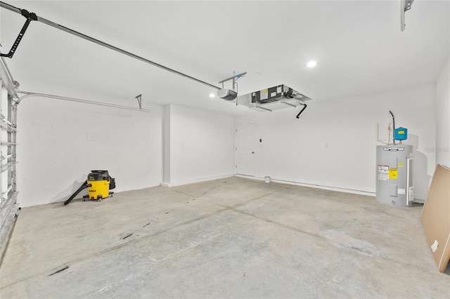 654 NE 130th Ct, Silver Springs, FL 34488 - garage with water heater, a garage door opener, and recessed lighting