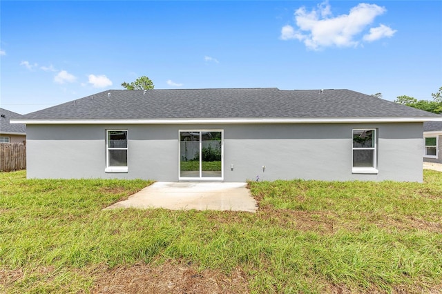 654 NE 130th Ct, Silver Springs, FL 34488 - rear view of house featuring a patio area, stucco siding, and a shingled roof