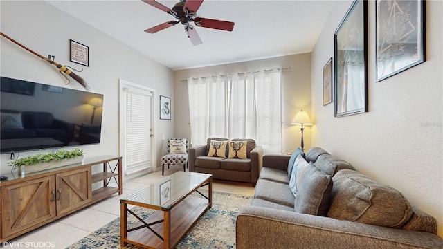 7675 Comrow St Unit 404, Kissimmee, FL 34747 - living room featuring ceiling fan and light tile patterned floors