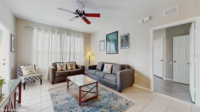 7675 Comrow St Unit 404, Kissimmee, FL 34747 - living room featuring light tile patterned flooring and ceiling fan