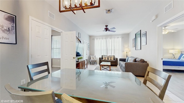 7675 Comrow St Unit 404, Kissimmee, FL 34747 - dining area featuring ceiling fan and a chandelier