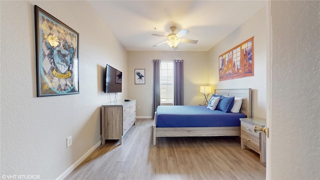 7675 Comrow St Unit 404, Kissimmee, FL 34747 - bedroom featuring light wood-style flooring, a textured wall, and ceiling fan
