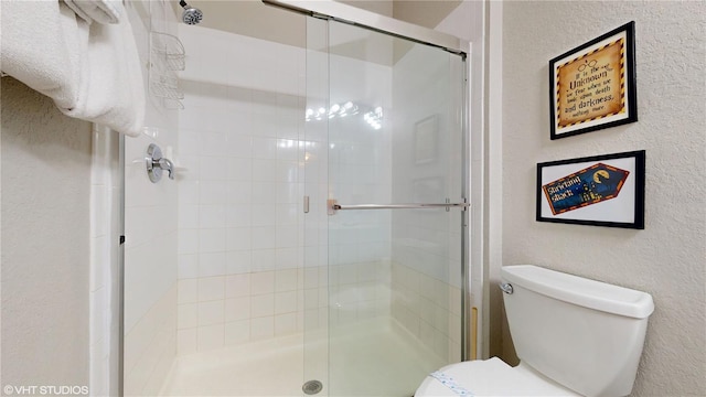 7675 Comrow St Unit 404, Kissimmee, FL 34747 - full bath featuring a stall shower and a textured wall