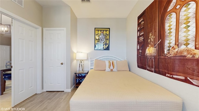 7675 Comrow St Unit 404, Kissimmee, FL 34747 - bedroom with light wood-style floors and baseboards