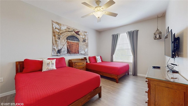 7675 Comrow St Unit 404, Kissimmee, FL 34747 - bedroom with wood finished floors and a ceiling fan